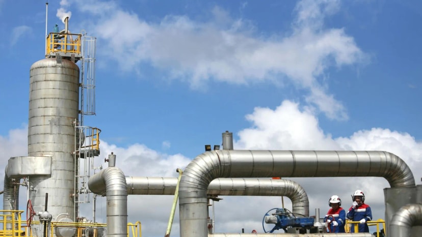 Engineer inspecting a rusty pipe in an industrial setting, demonstrating real-world infrastructure inspection use case.